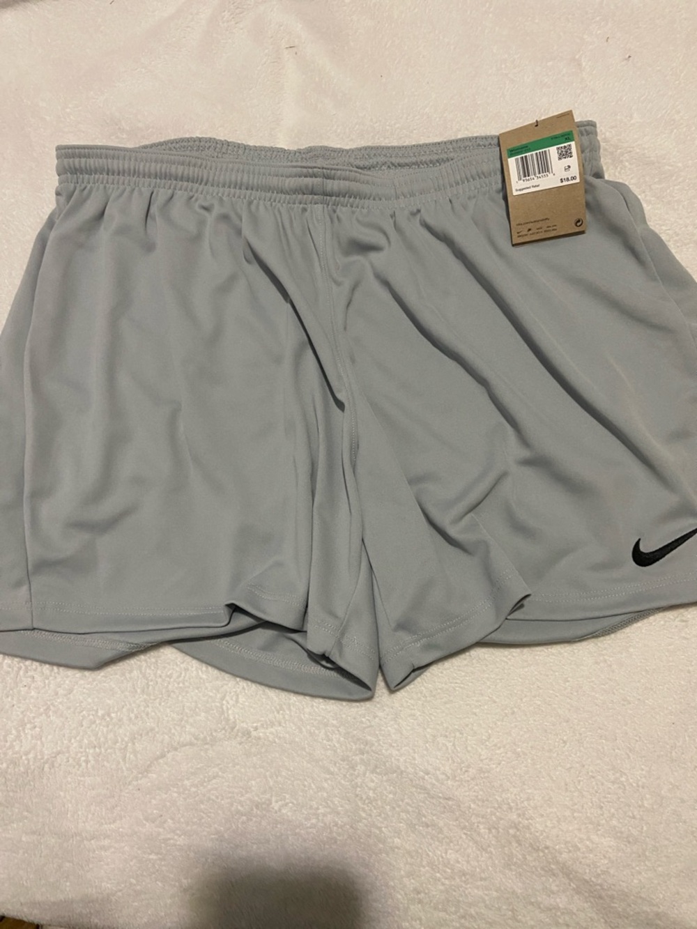 Nike Women’s Light Gray Athletic Shorts with Black Swoosh